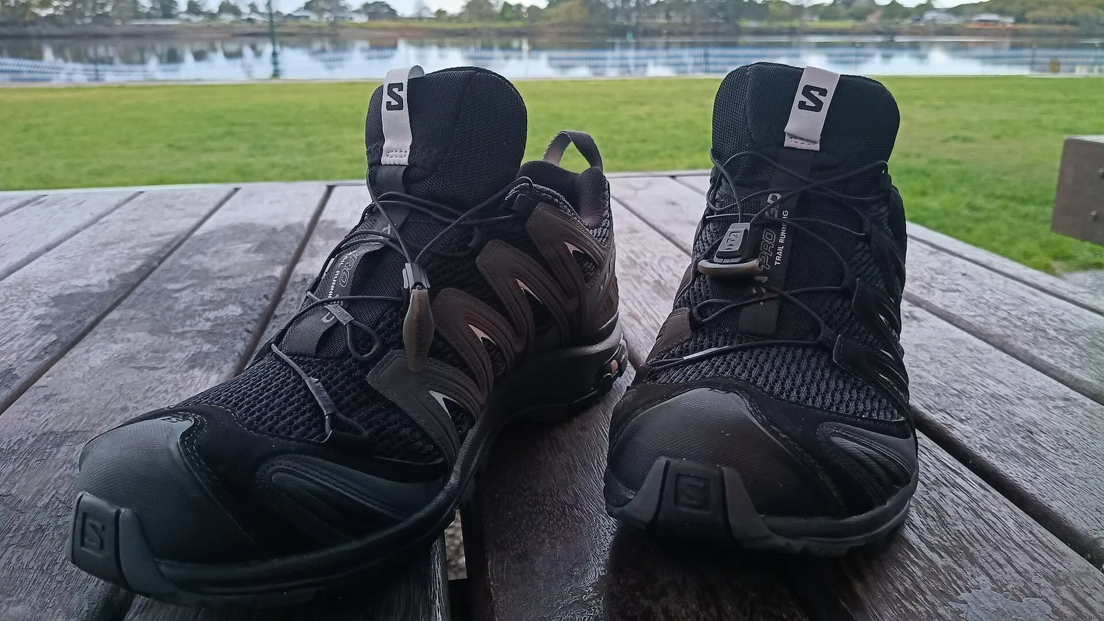 A trail running shoe photographed from the side