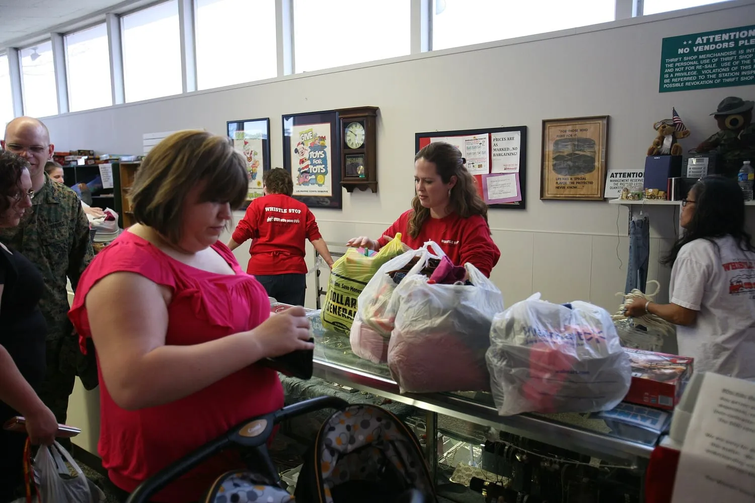 Racks of second-hand clothing at a charity sale